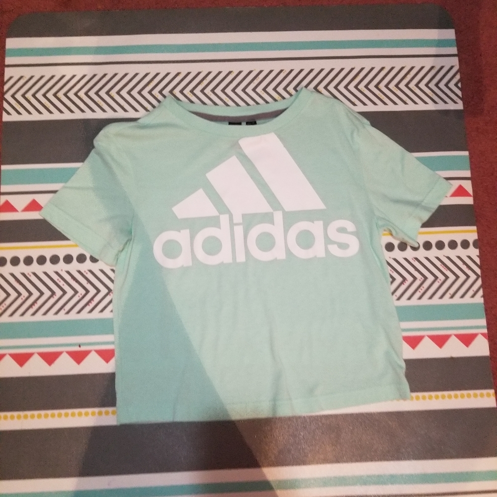 A cyan/ teal blue adidas shirt